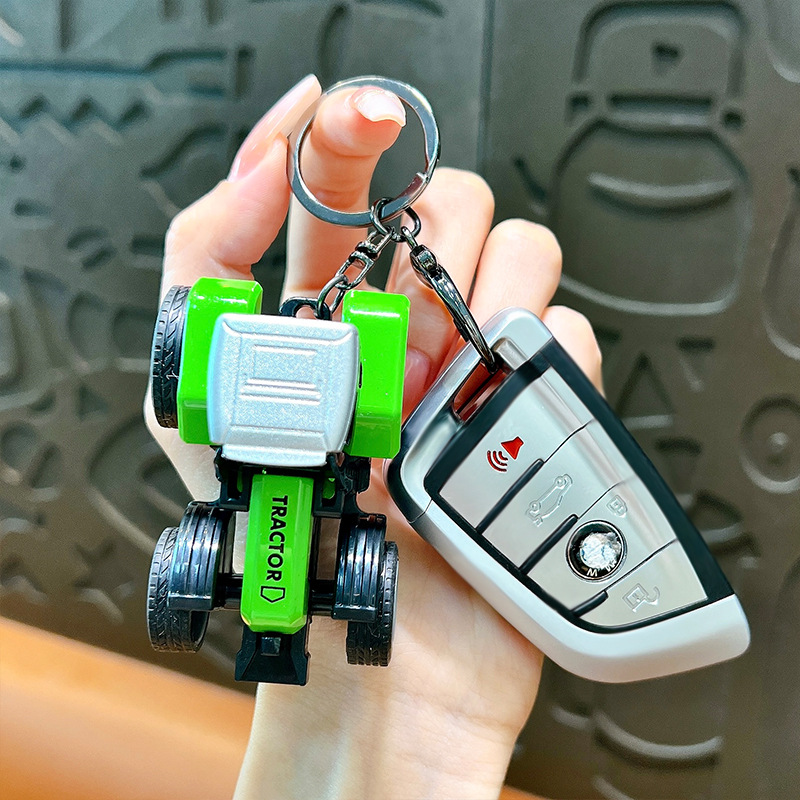 Model Simulation Mini Car Trac - مراجعة Heavy Equipment Key Ring وسعره